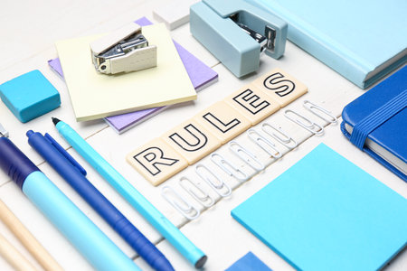 Word RULES with stationery supplies on white wooden background, closeupの写真素材