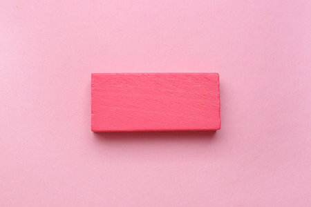 Pink block on color background. Rules conceptの写真素材