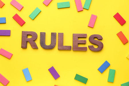 Word RULES with blocks on yellow background