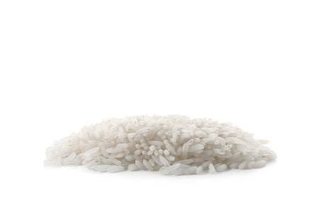 Pile of raw rice on white backgroundの写真素材