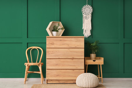 Interior of living room with wooden commode, chair and tableの写真素材