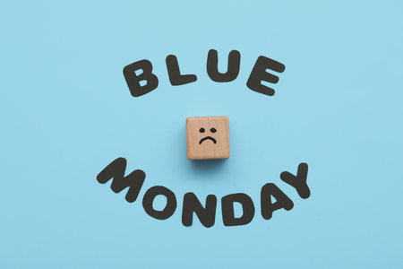 Text BLUE MONDAY and cube with drawn sad faceの写真素材