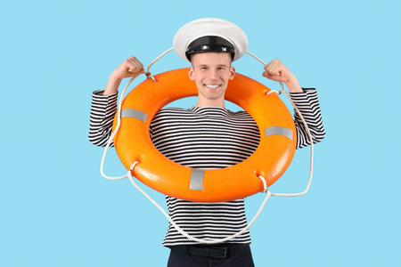 Male sailor with rescue ring showing muscles on blue background