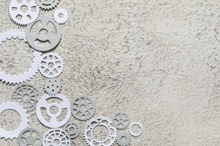 Different paper gears on gray background