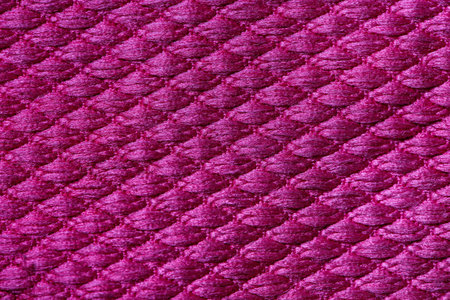 Texture of magenta fabric as background, closeup