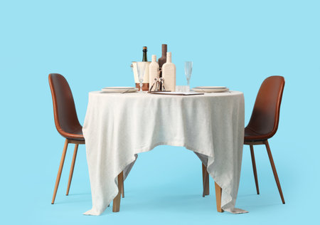 Served restaurant table with bottles on blue backgroundの写真素材