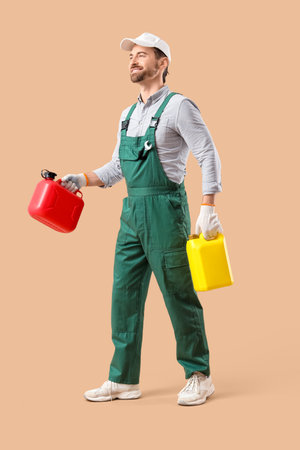 Mechanic with canisters on beige backgroundの写真素材