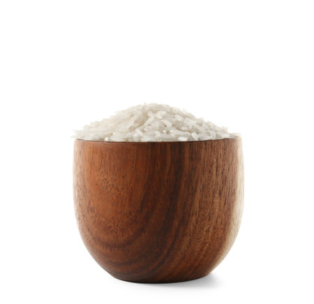 Wooden bowl with raw rice isolated on white backgroundの写真素材
