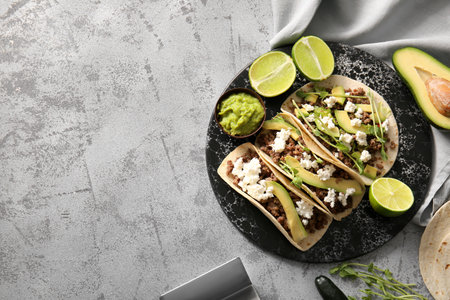 Tray with tasty tacos on gray grunge backgroundの写真素材
