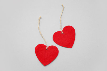 Heart shaped decorations with ropes on white background. Valentine's Day celebrationの写真素材