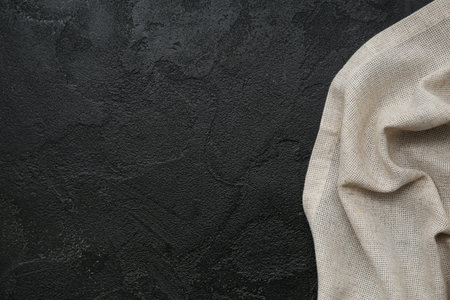 Canvas fabric napkin on black grunge background