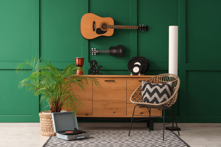 Interior of room with musical instruments, commode and armchairの写真素材
