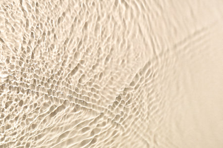 Texture of clean water with ripples on light background