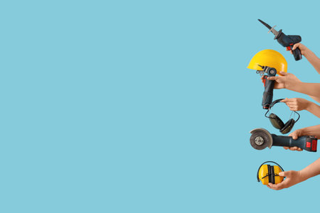 Many hands with construction tools on blue background