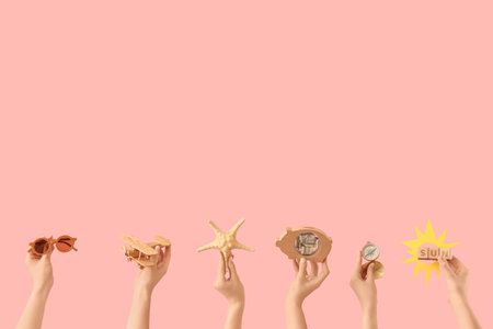 Female hands with beach accessories and piggy bank on pink background