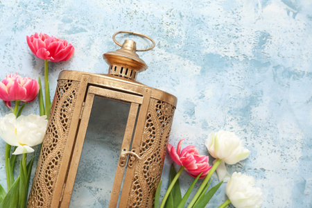 Fanoos with beautiful flowers on blue grunge background. Celebration