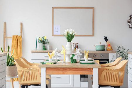 Dining table set for Easter with tulips in light kitchen