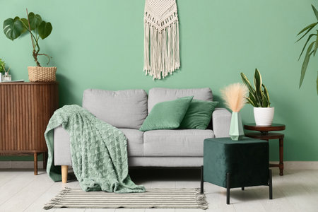 Interior of living room with sofa and green poufの写真素材