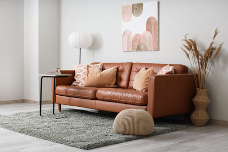 Comfortable sofa and coffee table in interior of modern living roomの写真素材