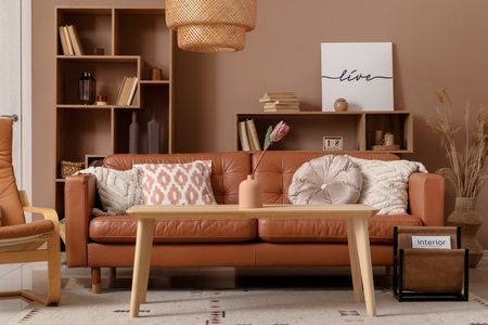Flower in vase on coffee table near sofa in living roomの写真素材