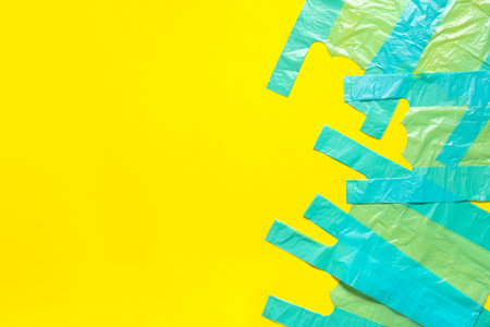 Plastic bags on yellow backgroundの写真素材