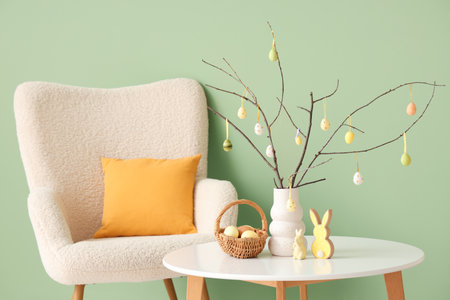 Interior of festive living room with white armchair, coffee table and Easter decorationsの写真素材