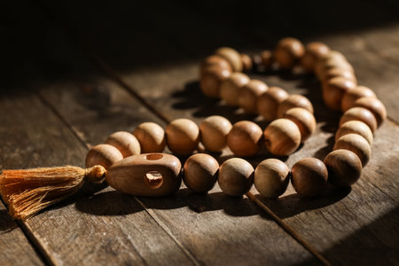 Prayer beads on wooden background, closeup. Ramadan celebrationの写真素材