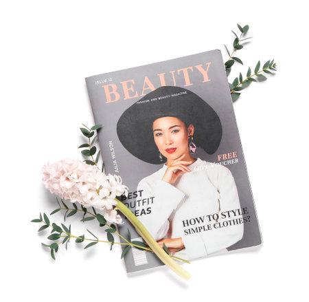 Magazine with flower and eucalyptus twigs on white backgroundの写真素材