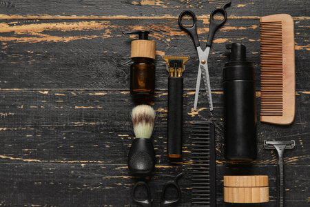 Modern trimmer and male shaving accessories on dark wooden backgroundの写真素材