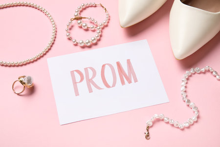 Paper with word PROM and female accessories on pink background, closeupの写真素材