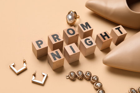 Cubes with text PROM NIGHT, high heels and jewelry on beige background, closeupの写真素材