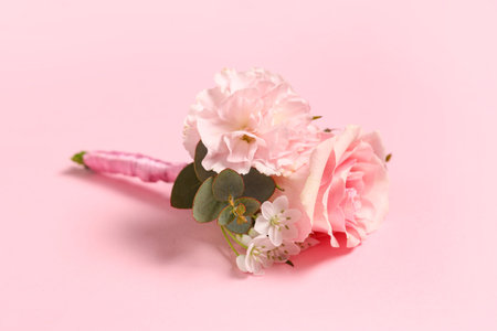 Beautiful boutonniere on pink background