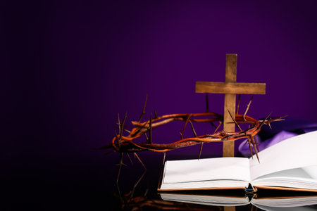 Crown of thorns with Bible, cross and purple cloth on table against color backgroundの写真素材