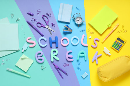 Text SCHOOL'S BREAK with different stationery on color backgroundの写真素材