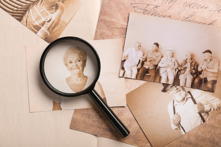 Old photos of relatives with letter and magnifier. Concept of family treeの写真素材