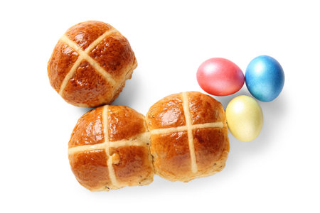 Easter buns with eggs on white backgroundの写真素材