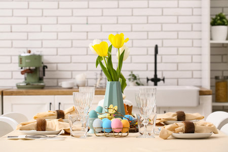 Festive Easter table setting in light kitchenの写真素材