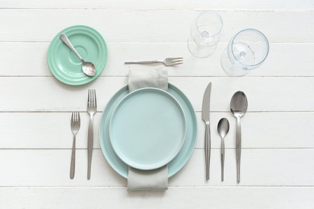 Beautiful table setting on white background. Top view