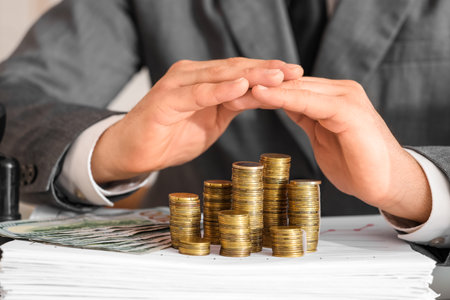 Businessman with money in office, closeup. Wealth conceptの写真素材