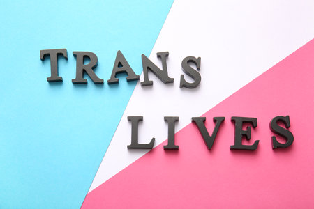 Text TRANS LIVES on color backgroundの写真素材