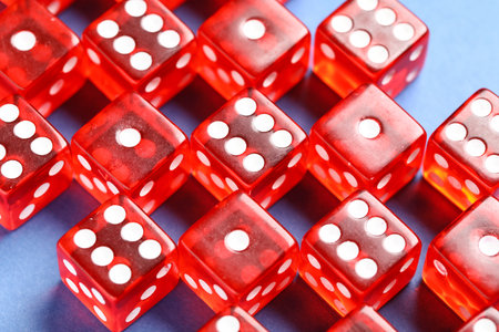Red game dices on blue backgroundの写真素材