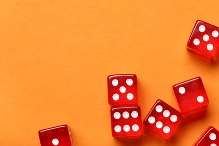 Red game dices on orange backgroundの写真素材