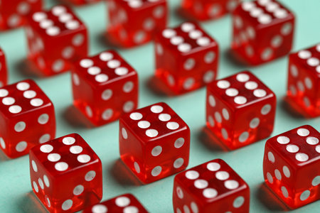 Red game dices on turquoise background, closeupの写真素材