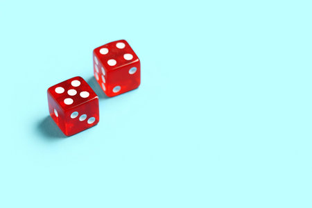 Red game dices on blue backgroundの写真素材