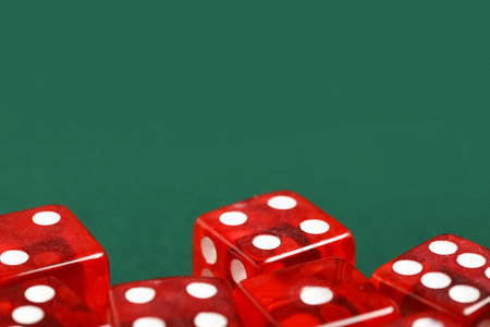 Red game dices on green background, closeupの写真素材