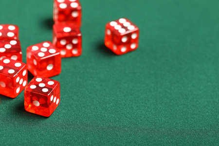 Red game dices on green backgroundの写真素材