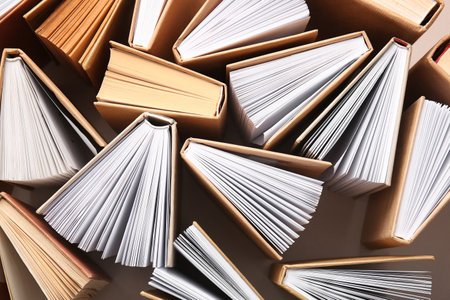 Composition with open books on beige backgroundの写真素材