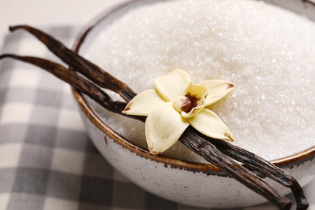 Bowl of sweet vanilla sugar on table, closeupの写真素材