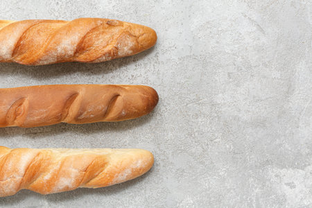 Fresh baguettes on gray backgroundの写真素材