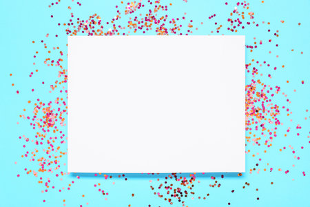 Blank card with beautiful confetti on blue backgroundの写真素材
